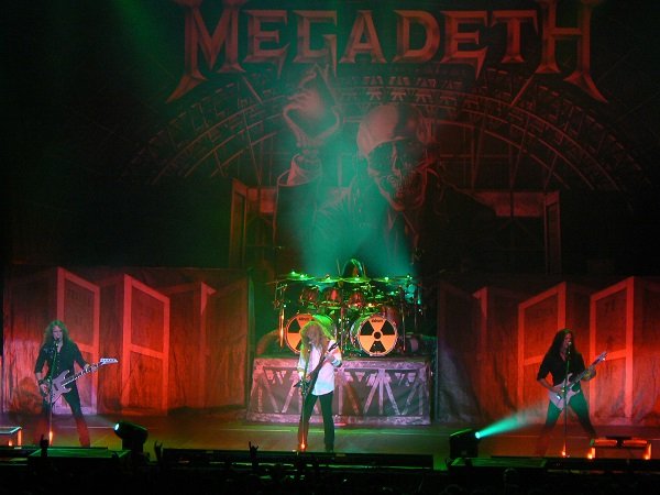 Megadeth.
You don’t sell over 50 million records worldwide without a sick name like Megadeth. Dave Mustaine pulled the name out of a song he had written which had the line “The arsenal of megadeath can’t be rid no matter what the peace treaties come to.”
After being fired from Metallica, he formed his own band and used the name “Megadeath” before dropping the second “a” after he found out that “The Megadeaths” was one of Pink Floyd’s initial names.