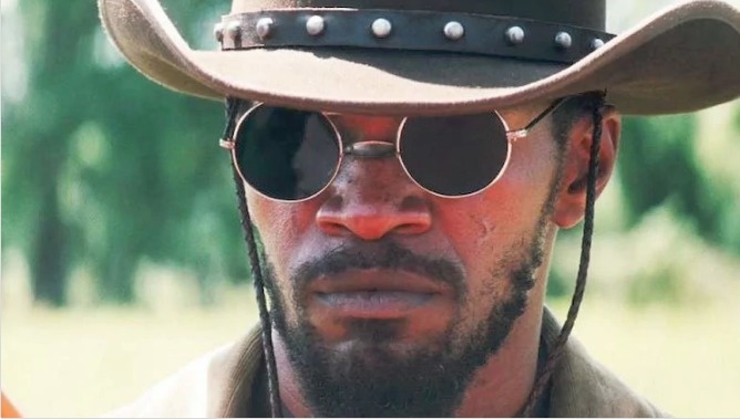 Django Unchained.
Jamie Foxx's character wears sunglasses through most of the movie which is set during the days of slavery. Slavery officially ended in the United States on December 6, 1865. Sunglasses, however, did not come to be made until 1925.