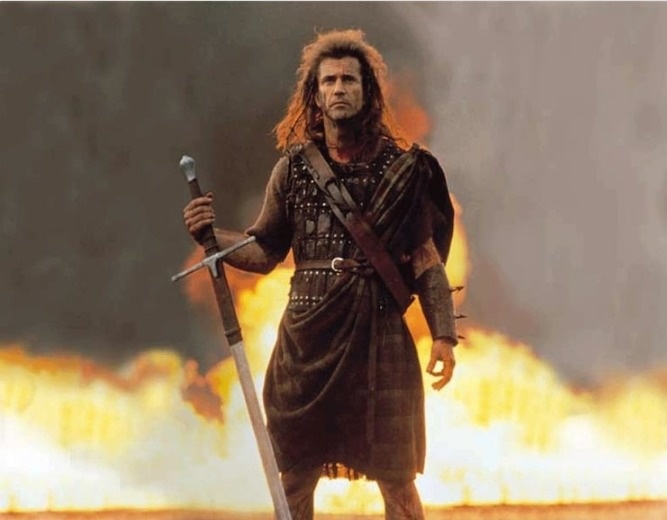 Braveheart.
William Wallace was a Scottish knight who fought for Scotland's independence from England in the late 1290's. Mel Gibson who played Wallace in the film Braveheart dons a Scottish kilt. Except, the Scots did not start wearing kilts till 1720.