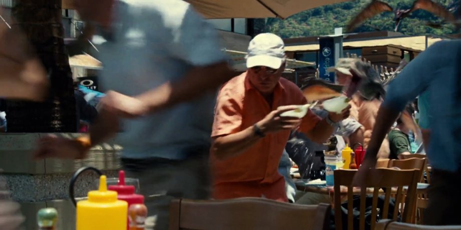 During the pterodactyl attack scene in ‘Jurassic World,’ you may have missed the famous Jimmy Buffett grabbing a few margaritas and running for cover. After this scene his character might not be wastin’ away again in Margaritaville.