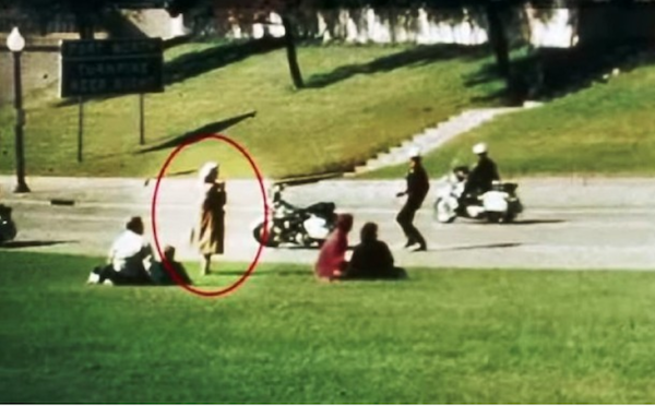 The Babushka Lady.
The Babushka Lady is an unidentified witness to the assassination of JFK. She was present during the motorcade in 1963 and was clearly either filming or photographing the events, and the angle that she was standing at, could dispel any doubts about the Grassy Knoll, and second shooters. Even as the shooting took place and all the other witnesses took cover, she calmly remained standing and recording the events. Neither she or the film have been identified.