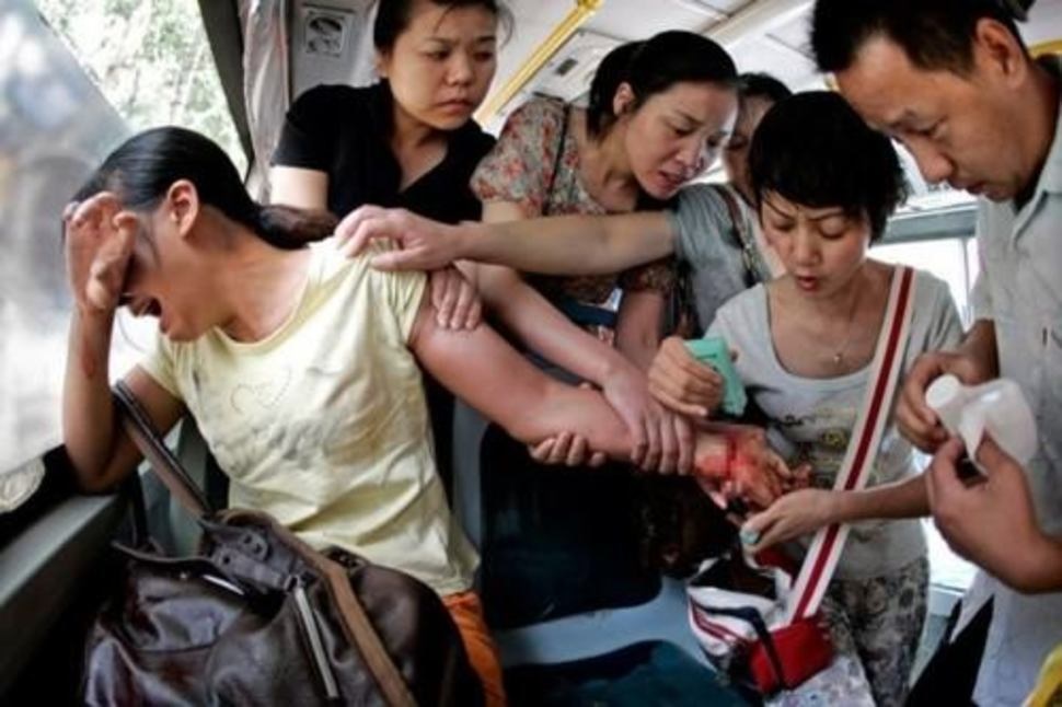 Caring people in a bus saving a woman who tried to commit suicide in China.