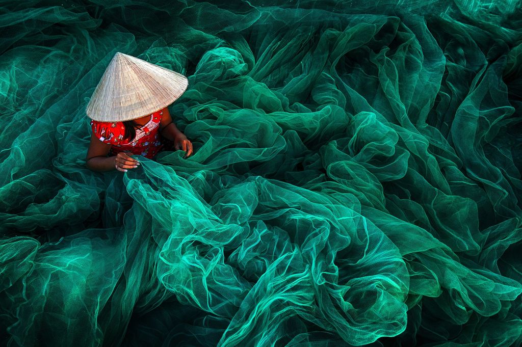 A Woman Crafts a Fishing Net near Phan Rang, Vietnam by Danny Sen Wong