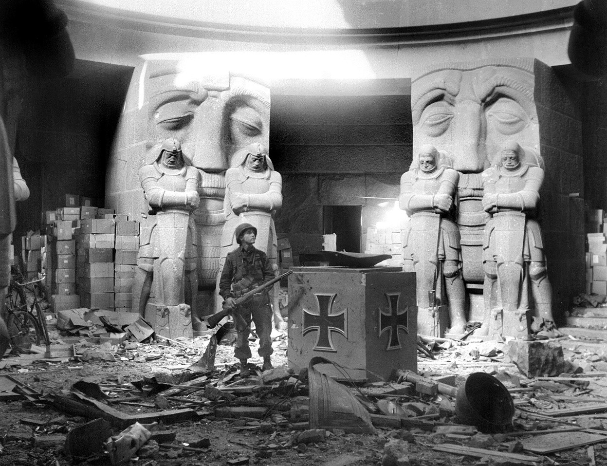 American soldier standing in the rubble of The Monument to the Battle of the Nations near Leipzig Germany, 1945