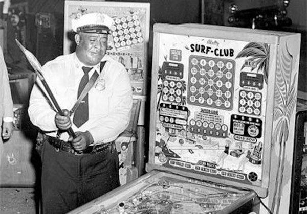 The Anti-Arcade Initiative
New York, 1952
In the 50s, New York was gripped with an anti-gambling mania, and Mayor Fiorello LaGuardia outlawed pinball of all things. He ordered police to raid arcades all over the city and seize thousands of machines. He then personally led a machine smashing frenzy with a sledgehammer, before dumping all the pieces into the ocean.