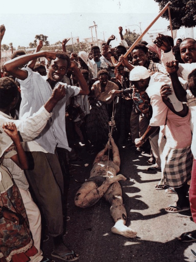 The mutilated body of a US soldier is dragged through the streets of Mogadishu. 1993.

This is from the 1993 Battle of Mogadishu (Somalia). The movie Black Hawk Down is based on this battle. The soldier is Staff Sergeant William David Cleveland, 34. He was awarded 4 medals posthumously.
