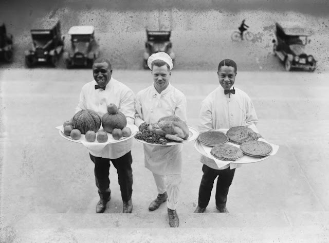 In 1922 three chefs are holding a complete meal that they put together. It consists of apples, pies and of course turkey.