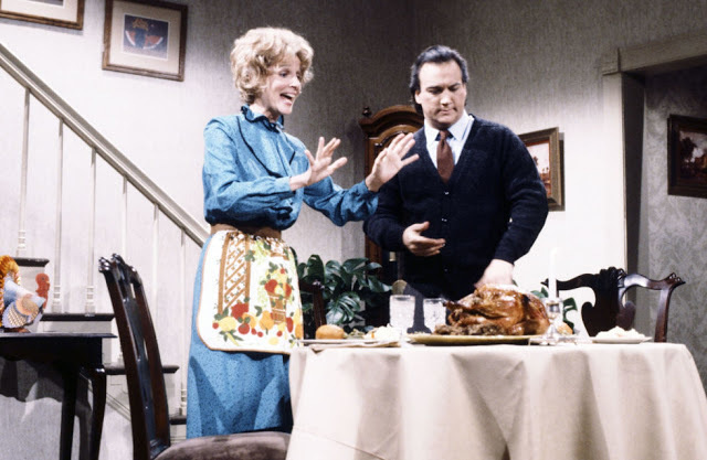 Everyone celebrates Thanksgiving during the season. Saturday Night Live legend Jim Belushi performs a skit here with Mary Gross on the show.