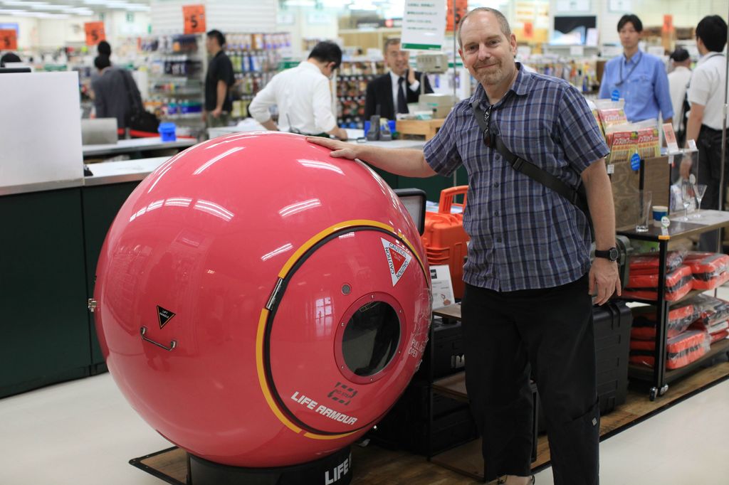 Tsunami evacuation pod sold in Japan department store. 

“Access to the capsule is by a marine-grade hatch that can be opened from either side, with the outside fitted with a universal marine rescue socket. Inside, there are racing-style seats with full four-point harnesses, water bladders, a GPS locator beacon, storage facilities for food and other survival supplies, and 60 minutes of oxygen for when the naturally aspirated vents are under water. The hull also allows for mobile phone use to communicate with the outside world.”