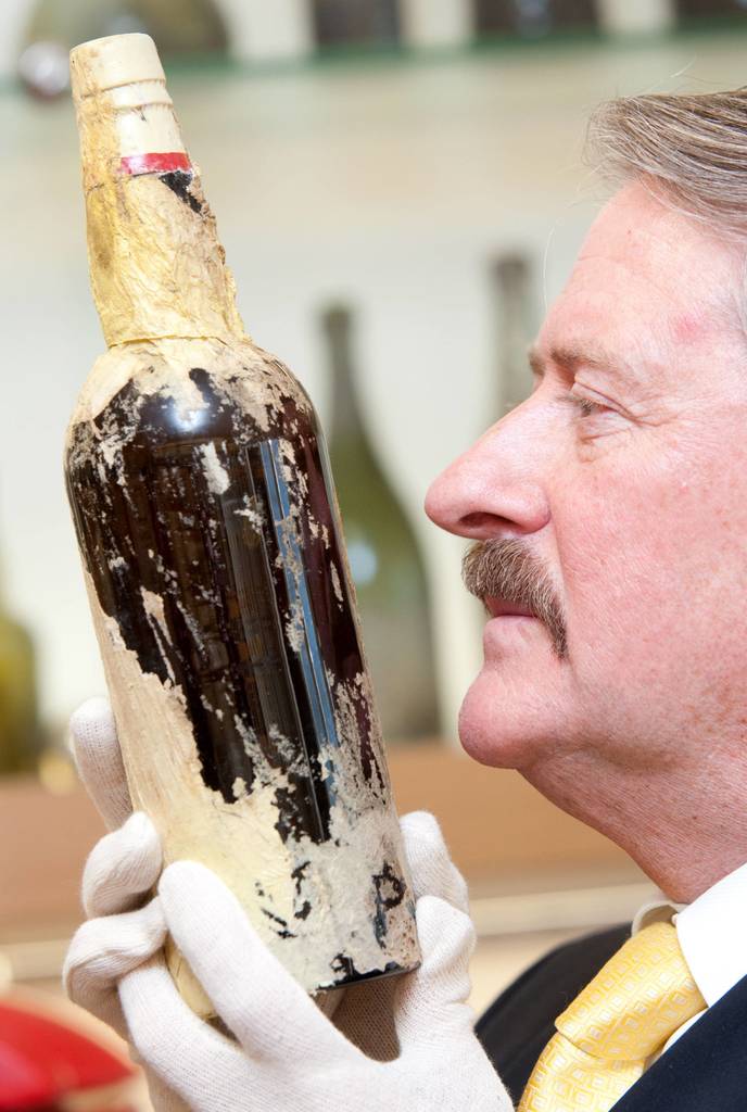 Bottle of Mackinlay’s Rare Old Highland Malt Whisky found frozen under the floorboards of explorer Ernest Shackleton’s hut at Cape Royds on Ross Island, 1907 ($50,000 scotch tasting)