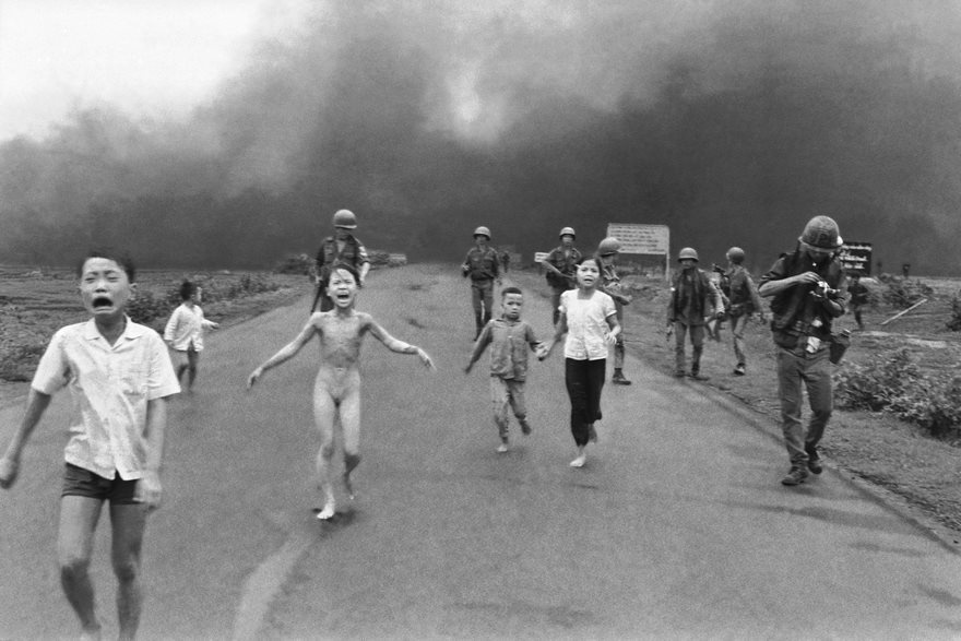 The Terror of War, Nick Ut, 1972.
Nick Ut's Pulitzer Prize-winning photo shows a heartbreaking scene of children fleeing a Napalm bombing in Trang Bang as a result of the Vietnam War. Phan Thị Kim Phúc, the 9-year-old girl pictured fully nude, was later known as the "Napalm girl." Despite being severely burned on her back, she survived the attack and has since undergone several surgical procedures.