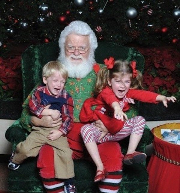 kids taking pictures with santa