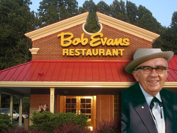 BOB EVANS.
Robert “Bob” Lewis Evans opened a truck stop diner near his farm in Rio Grande, Ohio in 1946. Dissatisfied with the then current sausages on the market, he opted to make his own using hogs from his own farm. What’s a farmer equivalent to a mic drop? We’ll say Bob Pitchfork dropped hard after his decision.