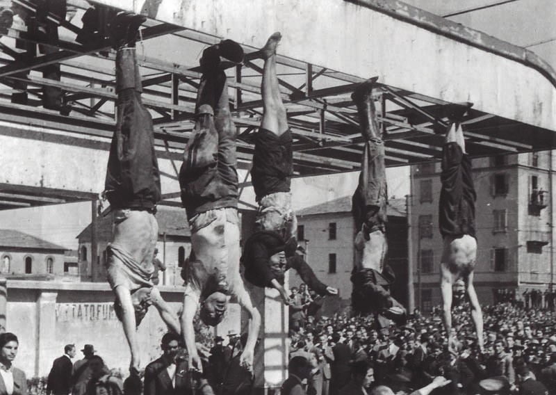 Benito Mussolini (second on the left) hanging from a lamppost in Piazzale Loreto, Milan along with other fascists, 29 April, 1945