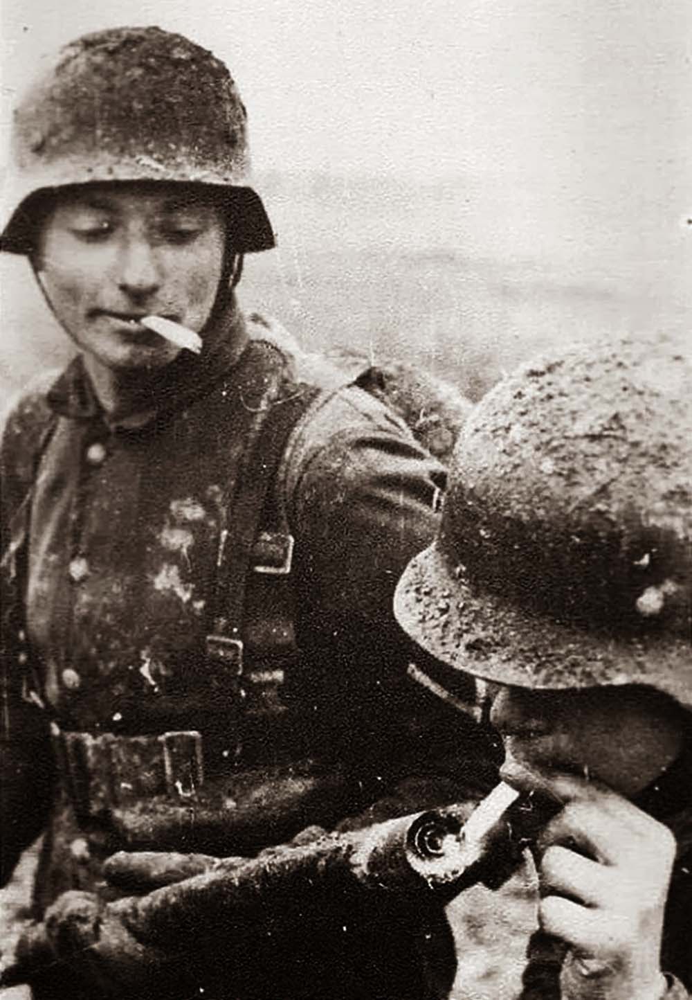 German soldier lighting his cigarette with a flamethrower, 1917.

The flamethrower, which brought terror to French and British soldiers was used by the German army in the early phases of the First World War in 1914 and 1915 (and which was quickly adopted by both). The Flammenwerfers (flamethrowers) tended to be used in groups of six during battle, each machine worked by two men. They were used mostly to clear forward defenders during the start of a German attack, preceding their infantry colleagues. They were undeniably useful when used at short-range, but were of limited wider effectiveness, especially once the British and French had overcome their initial alarm at their use. The operators of Flammenwerfer equipment also lived a most dangerous existence.
Quite aside from the worries of handling the device – it was entirely feasible that the cylinder carrying the fuel might unexpectedly explode – they were marked men; the British and French poured rifle-fire into the area of attack where Flammenwerfers were used, and their operators could expect no mercy should they be taken prisoner. Their life expectancy was therefore short.