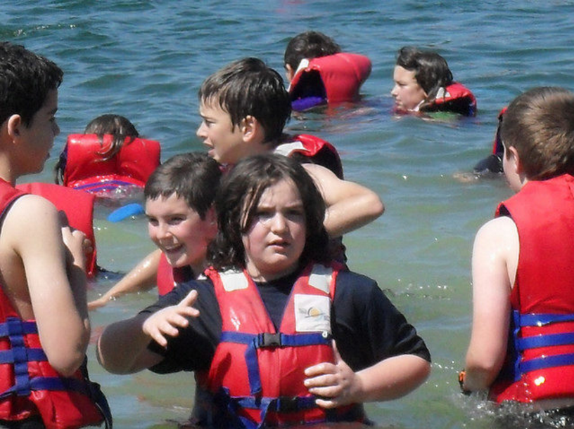 Inflate life jackets after exiting a plane during a water landing. Rushing waters can make inflating your life jacket harder while making a water landing. Swim to an exit and wait to inflate your jacket for the best chance of survival.