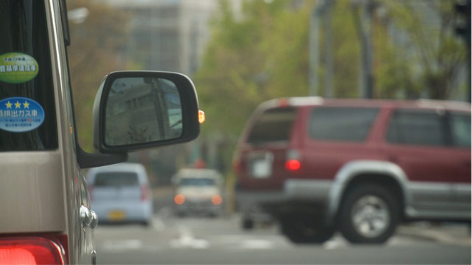 Adjsut your side mirrors accordingly. To best spot all potential hazards, position your mirrors so that the side of your car is barely visible.