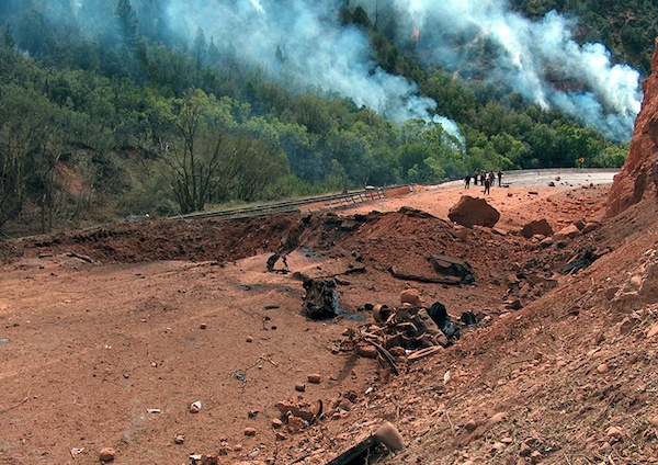 Like a scene from an action movie, metal shards, frayed pieces of tire, and an engine block were all that was left of a truck carrying 38,000 pounds of explosives after it's cargo detonated on U.S. Interstate 6 in Spanish Fork Canyon, Utah in 2005. 

The truck was going too fast, which caused it to tip over. It skidded across the pavement and started a fire on the mountainside. Motorists who stopped to help the driver out of the truck began running or driving away after discovering it was loaded explosives. At least 10 people were injured when it blew.