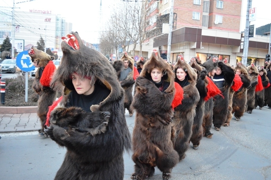 Romanians celebrate New Year's by donning real bear skins and dancing on the streets.