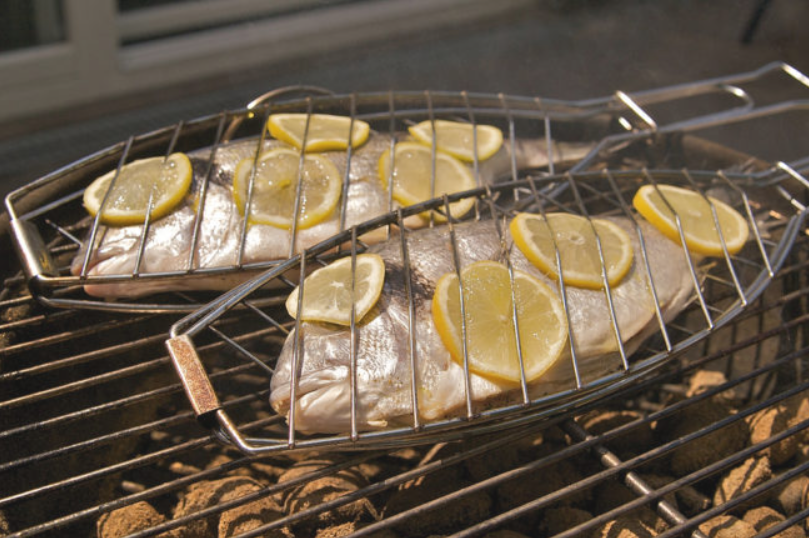 Grill fish with lemon for flavor and to keep it from sticking to the grates.