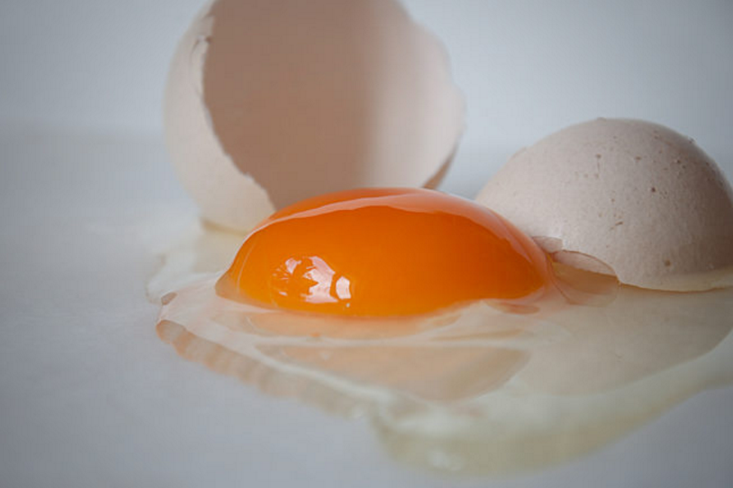 Use half an egg shell to scoop out any shell fragments.