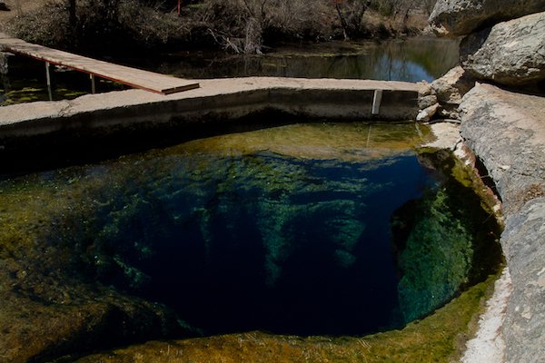 Jacob’s Well, Texas.
Jacob’s well is a 12-foot wide perennial spring, just outside of Wimberly, Texas. The well’s one of the creepiest places on earth, pretty much because it goes down 30 feet then levels off into an expansive underwater tunnel system that stretches for miles. So far, at least 8 divers have died in the system trying to map and explore the caves.
Imagine swimming in complete darkness, with your oxygen running low, you’re lost and confused and all you need is an air bubble to regain your composure, but there’s nowhere to stop and breathe. That’s my nightmare, right there.