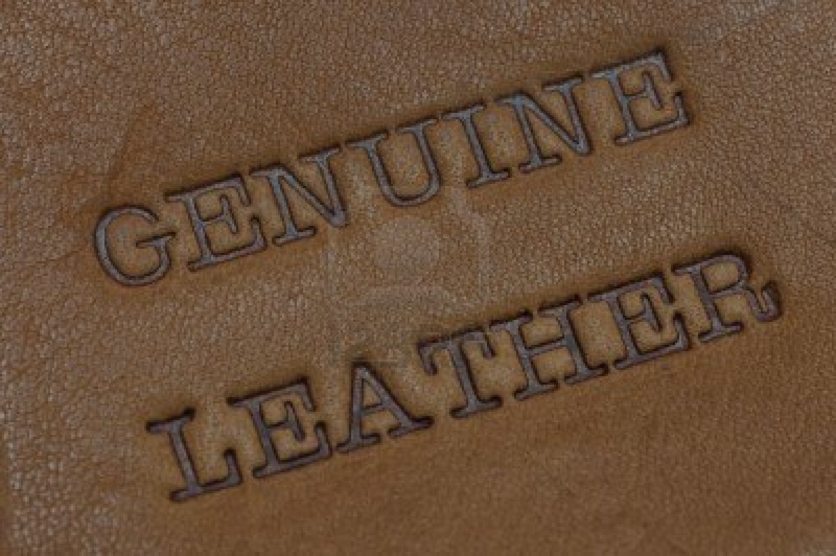The term “genuine leather” isn’t reassuring you that the item is made of real leather, it as an actual distinct grade of leather and is the second worst type of leather there is

The grades of leather as listed in the article in descending order of quality are:
Full-Grain Leather
Top-Grain Leather
Split-Grain Leather
Genuine Leather
Bonded Leather