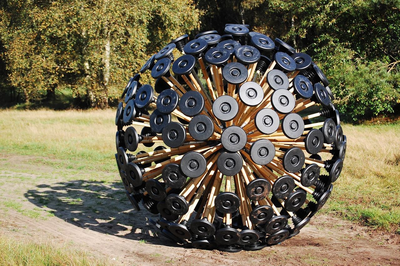 Wind driven sphere of bamboo and biodegradable plastic designed to clear land mines