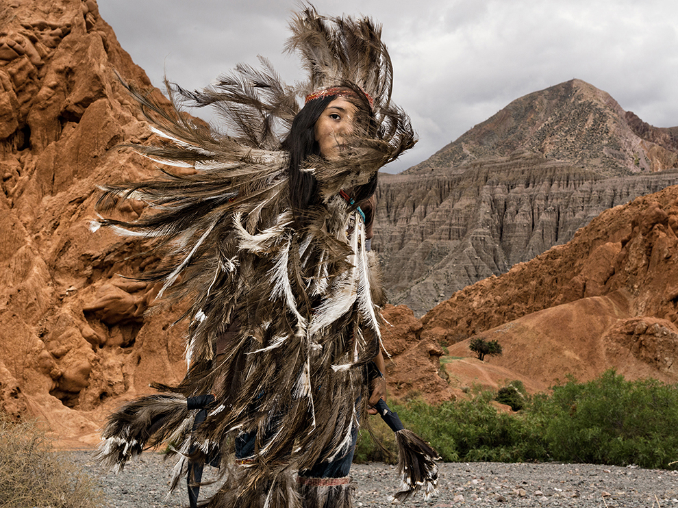 Feathered costume represents the nandu, or rhea, sacred bird of the Suris, Argentina