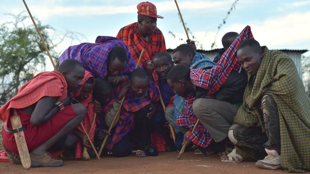 Massai tribesmen waiting to hear the US election results, Kenya