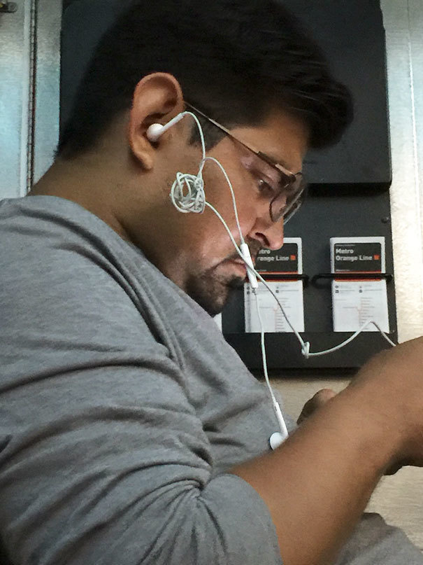guys with earbuds - Metro enge Line Orange Line