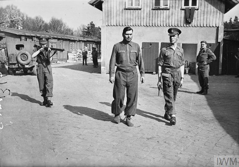 Commandant of the Bergen-Belsen concentration cam, Josef Kramer known as the “Beast of Belsen” paraded in irons before being sent to a POW camp to await trial. Belsen, April 1945.

He was detained by the British army after the Second World War, convicted of war crimes and hanged on the gallows in Hamelin prison