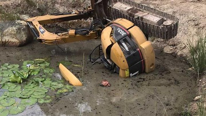 An Australian man was trapped for 2 hours in a dam with only his nose above water after his excavator shifted causing the machine to pin him down