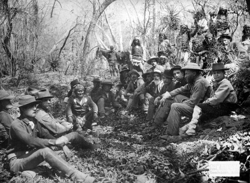 Geronimo (center left with the bandana) and General Crook (white hat, not looking at camera on the right) negotiating in 1886