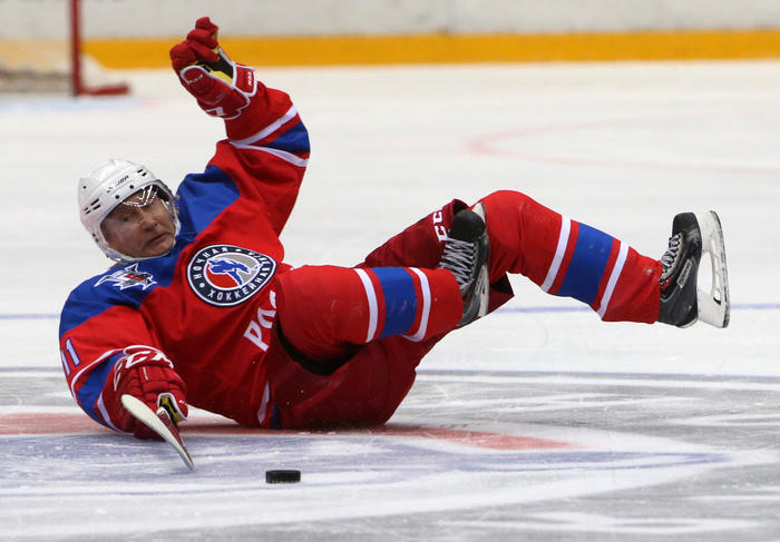 Vladimir Putin falling during an old time Russian players hockey game he participated in, 2011