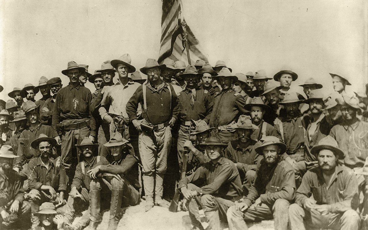 Teddy Roosevelt posing with his Rough Riders during the Spanish American War, 1898
