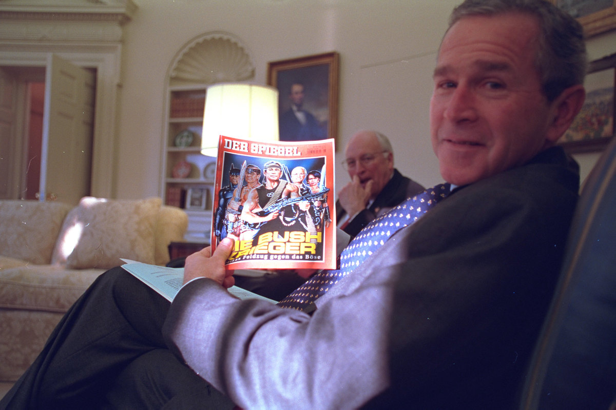 George W. Bush and Dick Cheney laugh at a German magazine depicting them in 2002