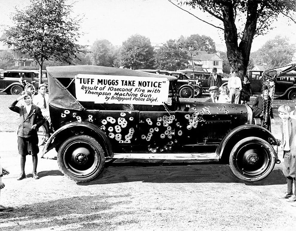 Police and Fireman’s Day display of a gangster’s car riddled by Thompson machine guns for ten seconds on September 24, 1930