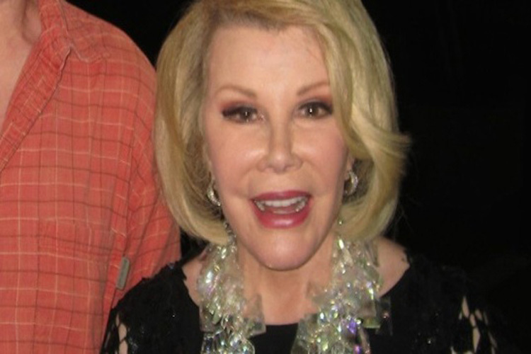 Joan Rivers.
A snapshot of Joan smiling taken the evening before she was scheduled for an under the knife procedure that ultimately caused her death. The great comedy legend died from low oxygen during the procedure according to the New York City medical examiner. She was 81 years old.