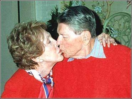 Ronald Reagan.
A sweet shot of 40th President of the United States kissing his wife Nancy Reagan that he didn't recognize because he suffered from Alzheimer's.