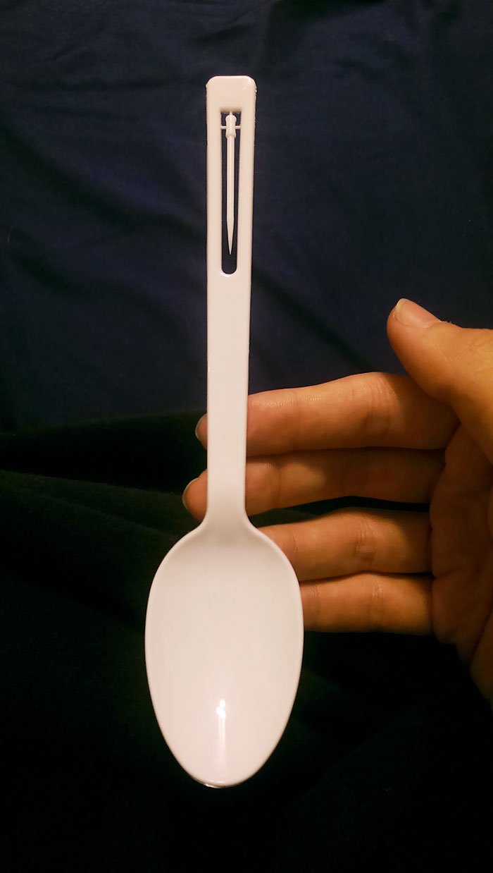 Plastic spoon has a built-in toothpick.