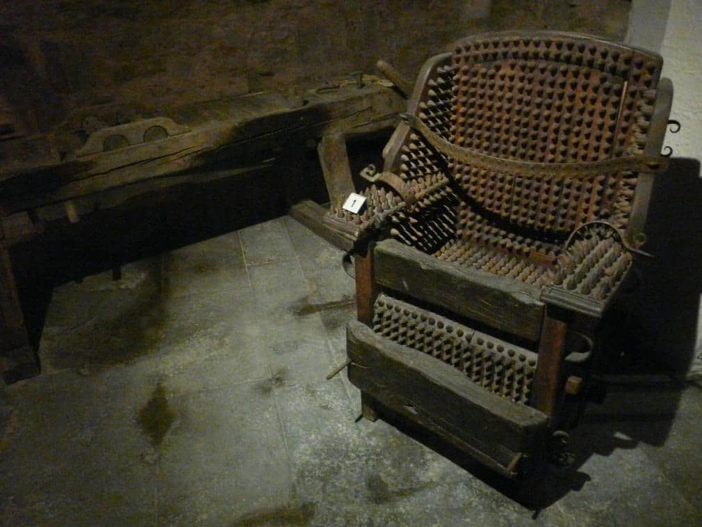 THE CHAIR OF TORTURE.

Also known as the Judas Chair, it was a terrible, intimidating torture device that was added to dungeons in the Middle Ages. Used until the 1800′s in Europe, this chair was layered with 500 to 1,500 spikes on every surface with tight straps to restrain its victim. Made of iron, it can also contain spaces for heating elements beneath the seat. It was often used to scare people into giving confessions as they watched others being tortured on the device.
