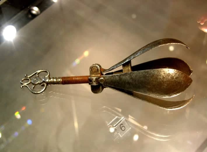 PEAR OF ANGUISH/CHOKE PEAR.

The pear of anguish or choke pear is the modern name for a type of instrument displayed in some museums, consisting of a metal body (usually pear-shaped) divided into spoon-like segments that could be spread apart by turning a screw. The museum descriptions and some recent sources assert that the devices were used either as a gag, to prevent people from speaking, or internally as an instrument of torture.