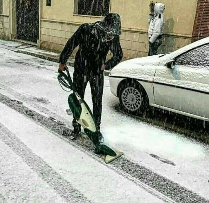 guy vacuuming snow