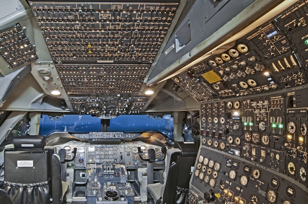 The pilot’s seat and cockpit of a Boeing 747 passenger jumbo jet … has 980 buttons and dials.