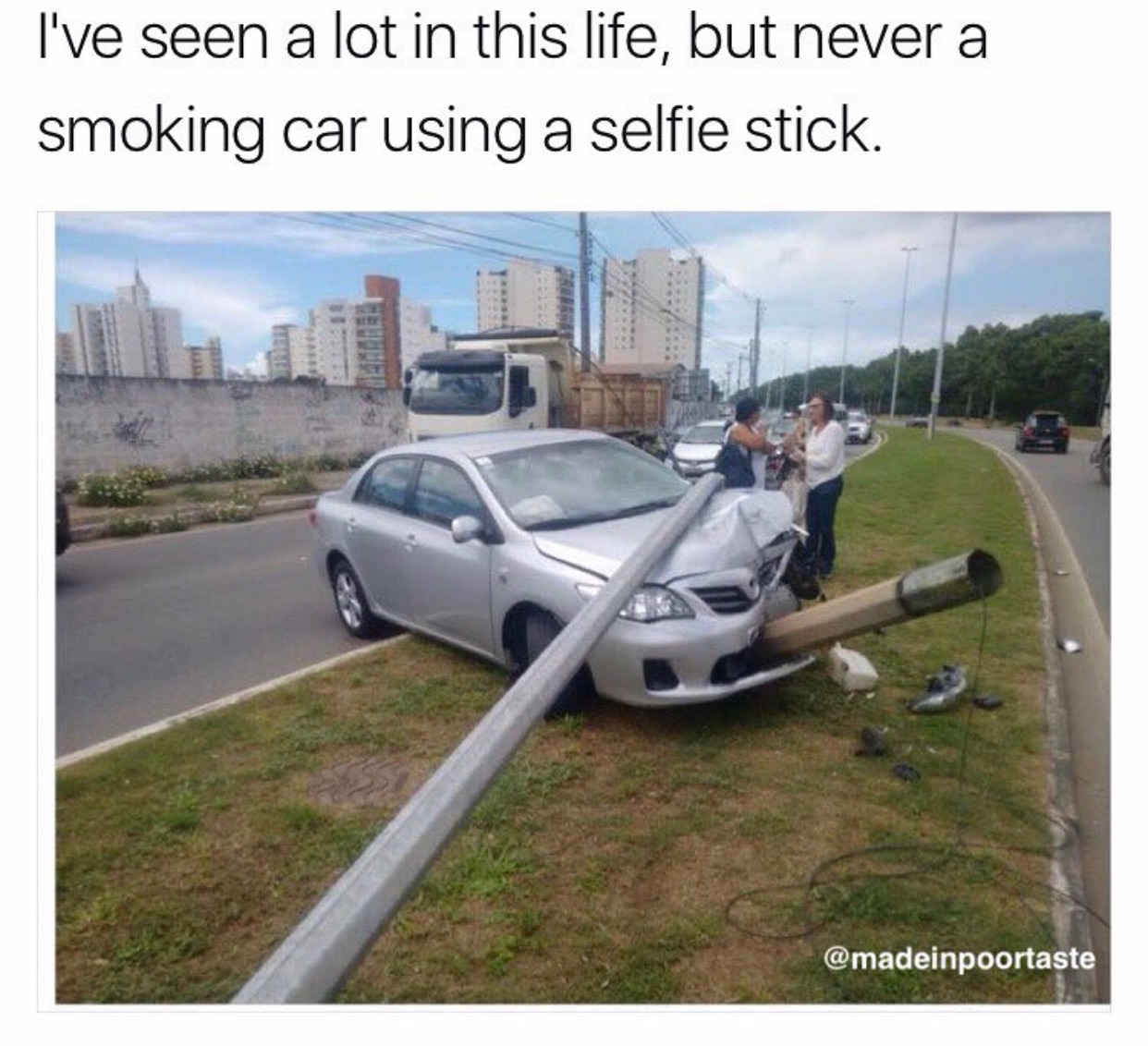 smoking corolla using a selfie stick - I've seen a lot in this life, but never a smoking car using a selfie stick.