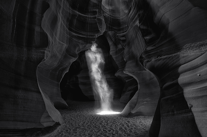 This Is The Most Expensive Photograph In the World $6.5 Million.

“Phantom” – A photograph by Australian photographer Peter Lik, was sold to a private collector for a staggering $6.5 million. The black and white image shows a beam of light resembling a ghost, and was captured at Arizona’s Antelope Canyon, a slot canyon that’s popular among landscape photographers.
“Certain textures and contours found in nature lend themselves beautifully to black and white photography,” Lik said in the statement.“The intensity of contrasting light and dark spaces was surprising, but made for some of the most powerful images I’ve ever created.”