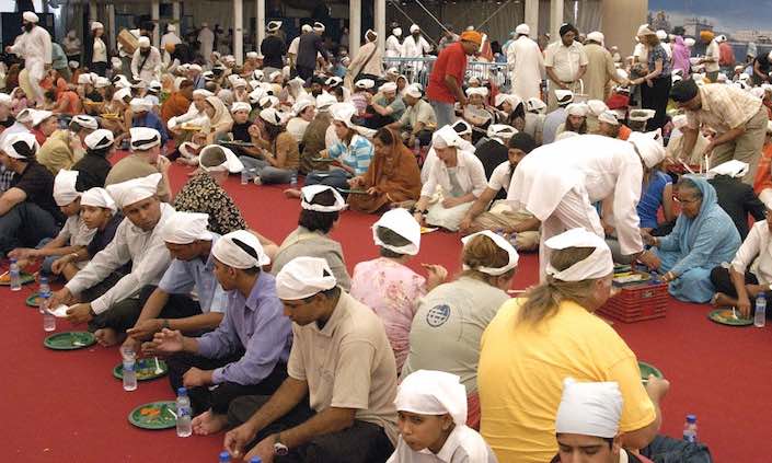 Anybody can walk into a Sikh temple after prayers and partake of the free communal meal called langar. The meal, a symbol of equality and community is given to anybody who wishes to partake, without any expectation of payment. 

One of the most obvious signs of caste inequality in traditional Indian society is the taboo against eating with those outside one’s caste group, of a lower caste, or of a different religion. Rules for the sharing of food and water are many, especially among high caste Hindus. From the beginning, the Sikh Gurus explicitly rejected this inequality by asking that all Sikhs and all visitors to the Sikh gurdwaras partake of common food in the company of one another. In the langar hall, women and men, rich and poor, high and low sit together. The langar meal thus assails the inner core of inequality and symbolizes a Sikh’s personal rejection of prejudice.