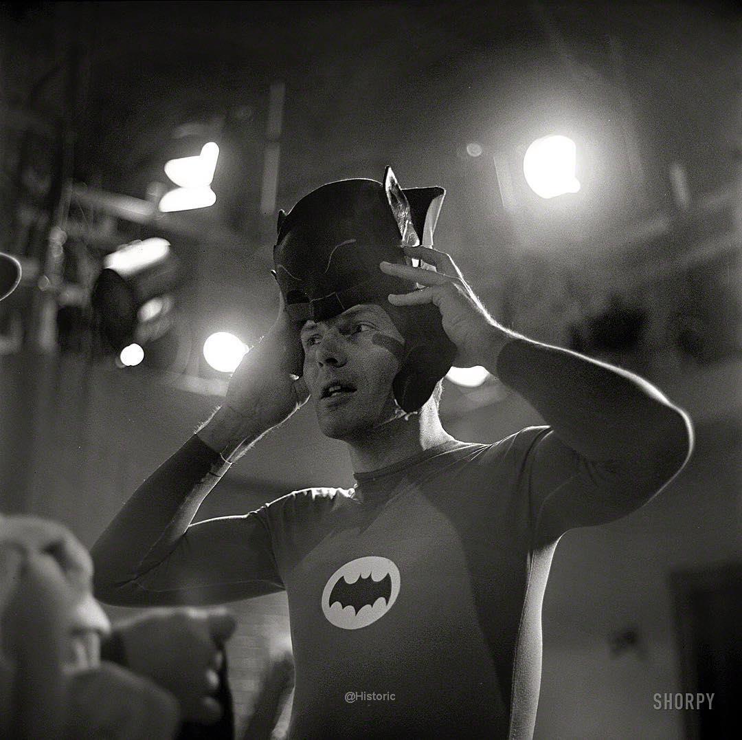 Adam West donning the cowl on the set of Batman 1966