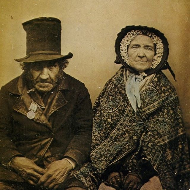 A portrait of a British war veteran and his wife, circa 1855. His medal indicates that he fought in five battles during the Napoleonic Wars